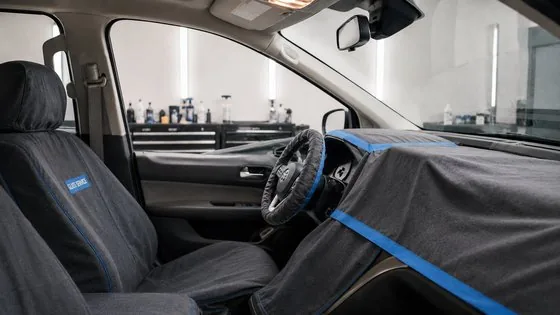 Vehicle interior fully masked during glass service